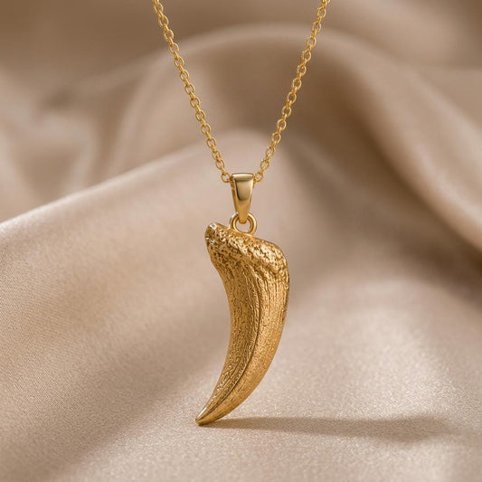 Smilodon Fang Fossil jewelry design featured in the Rimossa meaning guide