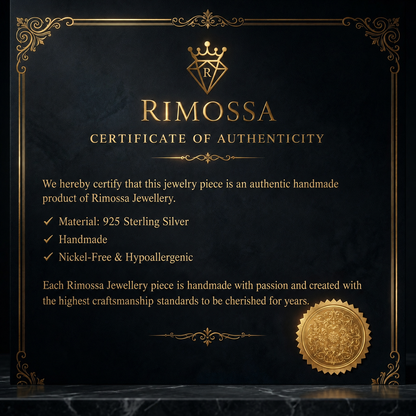 Oxidized 925 sterling silver pendant necklace with raised sun medallion, branching relief, dawn ray details, shield-shaped frame and curb chain on a dark background.