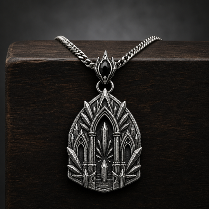 Oxidized 925 sterling silver pendant necklace with a sacred arch temple relief, raised shard-like silver details, round connector and curb chain on a black background.