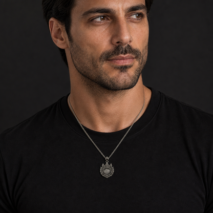 Oxidized 925 sterling silver pendant necklace with a crown, laurel wreath, crescent medallion, black faceted accent on the bail, and curb chain.